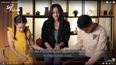 Ingy and her children from Sudan praying together