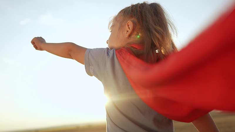 Girl dressed in superhero costume