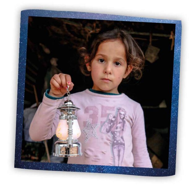 Girl holding lantern